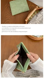 Detail of sage green cowhide leather wallet with card slots and metal zipper