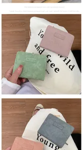 Close-up of minimalist women's leather wallets in multiple soft pastel color options
