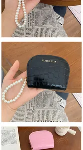 Detailed macro view of crocodile pattern leather texture and elegant pearl handle strap