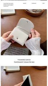 Détail de la fermeture magnétique et de la doublure noire du portefeuille en toile
