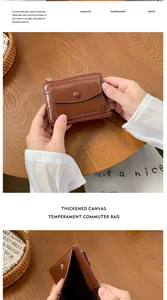 Detail of brown leather multi-functional mini wallet with zipper and snap closure