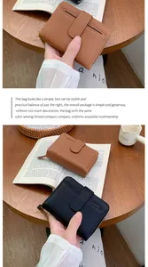Detail of lychee pattern leather wallets in black and brown with snap fastener closure