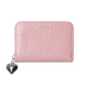 Pink textured leather card holder with heart pendant and silver Simple text detail