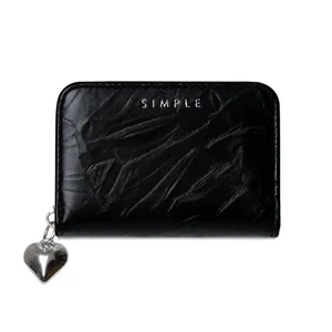 Detail of black cracked texture PU leather wallet with silver heart zipper and SIMPLE logo