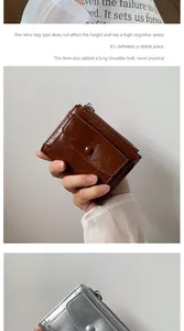 Close-up of vintage oil wax leather wallet with button flap and smooth zipper detail