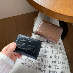 Minimalist vintage textured PU leather zip card holder for women in black and brown