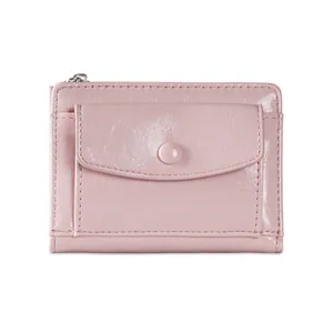Close-up of pink glossy textured wallet featuring silver zipper and snap pocket detail