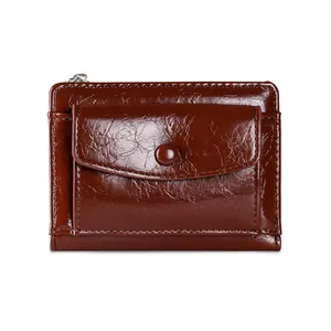 Detail view of glossy brown wallet with premium leather texture and precise stitching