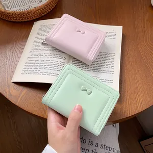 Piccolo portafoglio pieghevole da donna con fiocco decorativo in rosa e verde menta