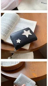 Detailed macro view of the star-patterned faux leather wallet with premium metal zipper