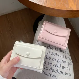 Elegant short PU leather wallet for women with snap flap and top zipper in pink and white