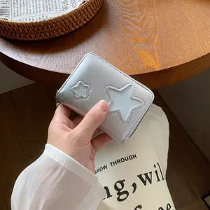 Silver PU leather mini wallet featuring hollow star designs and zipper closure