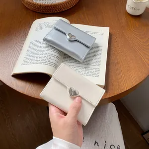 Chic heart buckle bi-fold wallet in silver and off-white with cracked leather texture