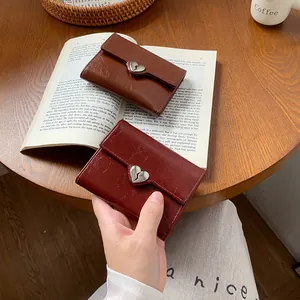 Vintage heart buckle trifold wallet in brown and burgundy cracked leather