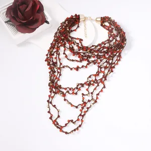 Bohemian multi-layer hand-beaded necklace in reddish-brown and gold tones with lobster clasp