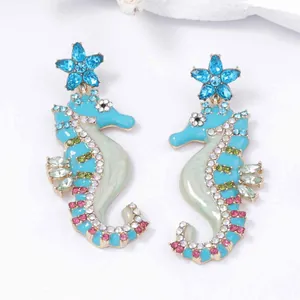 Seahorse dangle earrings with blue starfish tops and colorful crystal rhinestone inlay