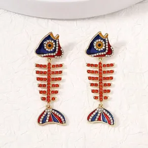 Boucles d'oreilles arête de poisson avec strass rouges et émail coloré incrusté