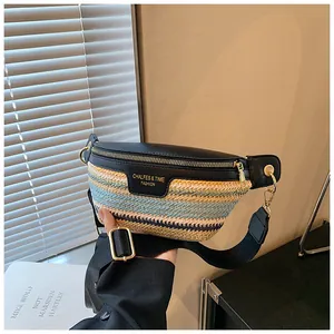 Detail of woven crossbody bag showing leather contrast, gold hardware, and brand logo