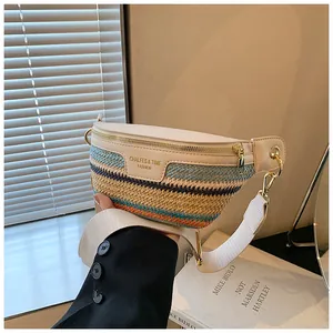 Detailed close-up of beige leather and multi-color woven crossbody bag with gold zipper