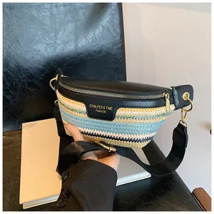 Close-up of woven crossbody bag with colorful stripes, black leather flap and gold zipper