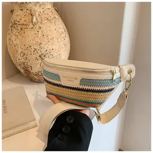 Detail of woven straw texture and cream leather on a stylish crossbody dumpling bag