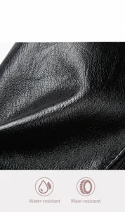 Detailopname van zwart kiezelleder met waterbestendige en krasbestendige textuur