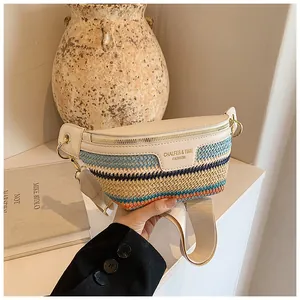 Close-up of woven crossbody bag with colorful stripes and beige faux leather details