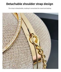 Close-up of golden spherical evening bag with removable metal chain strap and glitter finish