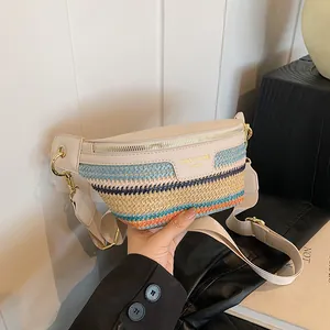 Woven crossbody chest bag with colorful straw stripes and cream leather trim