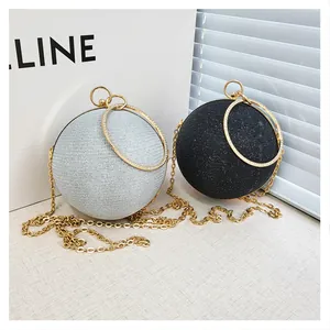 Détails des sacs de soirée ronds pailletés argent et noir avec poignées en diamant