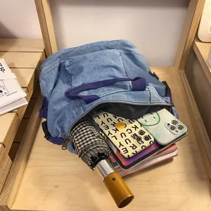 Japanese style washed denim canvas backpack with purple straps and large storage capacity