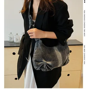 Chic grey washed denim crescent shoulder bag with knot detail and large capacity