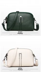 Close-up of shell-shaped crossbody bags in green and white with leather texture details