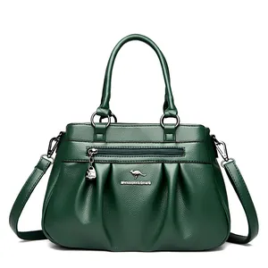 Dark green pleated leather handbag with dual handles and crossbody strap