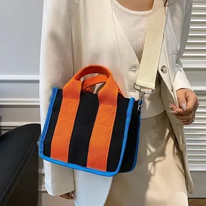 Canvas draagtas in contrastkleuren met oranje handvaten en blauwe rand voor dames