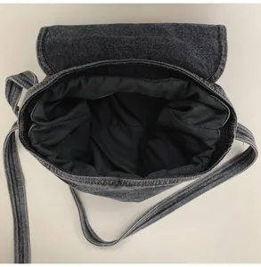 Interior view of deep gray washed denim shoulder bag with spacious main compartment