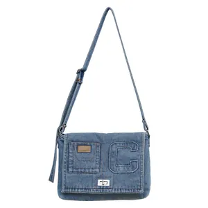 Minimalist blue washed denim crossbody bag with silver twist lock and letter embroidery