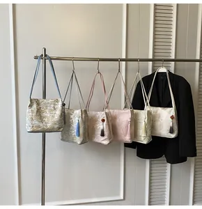 Detail of New Chinese style jacquard tote with traditional patterns and silk tassels