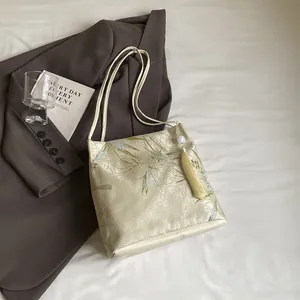New Chinese style beige satin shoulder bag with green bamboo embroidery and silk tassel
