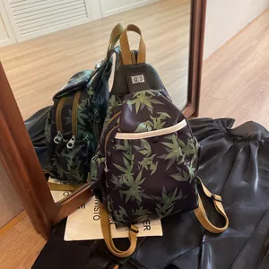 Detail of the large-capacity New Chinese style backpack with green bamboo leaf prints