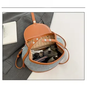 Top view of contrast color backpack showing internal capacity and striped lining