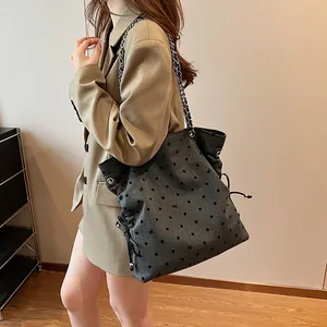 Deep grey denim tote bag with black polka dots and silver chain strap for women