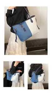 Détail du grand sac cabas en denim patchwork avec garnitures en cuir et bandoulière
