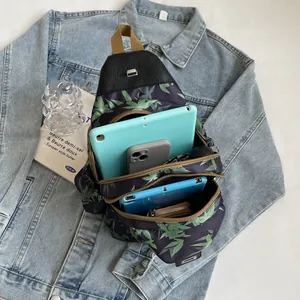 Detailed internal compartments of bamboo print crossbody bag with multiple storage pockets