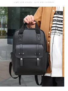 Detail of black PU leather backpack showing silver buckles and lychee texture finish