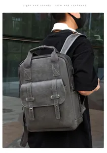 Close-up of retro grey PU leather backpack showing lychee texture and metal rivets
