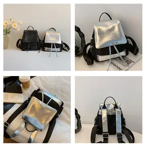 Detail view of mini contrast backpack with drawstring closure and metal zipper pockets
