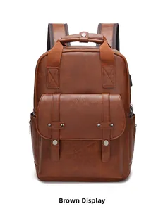 Detail showing the brown PU leather texture and reinforced handle of this vintage backpack