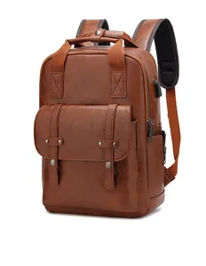 Detail view of the vintage brown PU leather backpack with integrated USB charging port