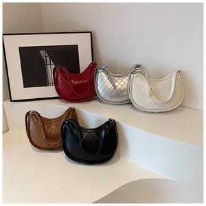 Detailed display of quilted hobo bags in five colors on minimalist geometric stands